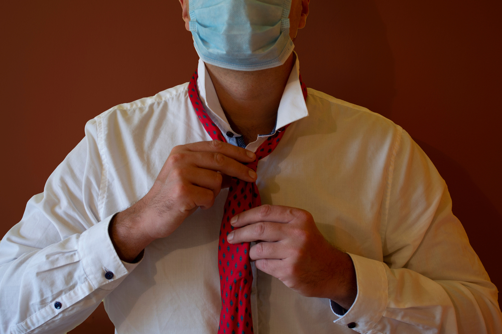 A person wearing a neck tie

Description automatically generated