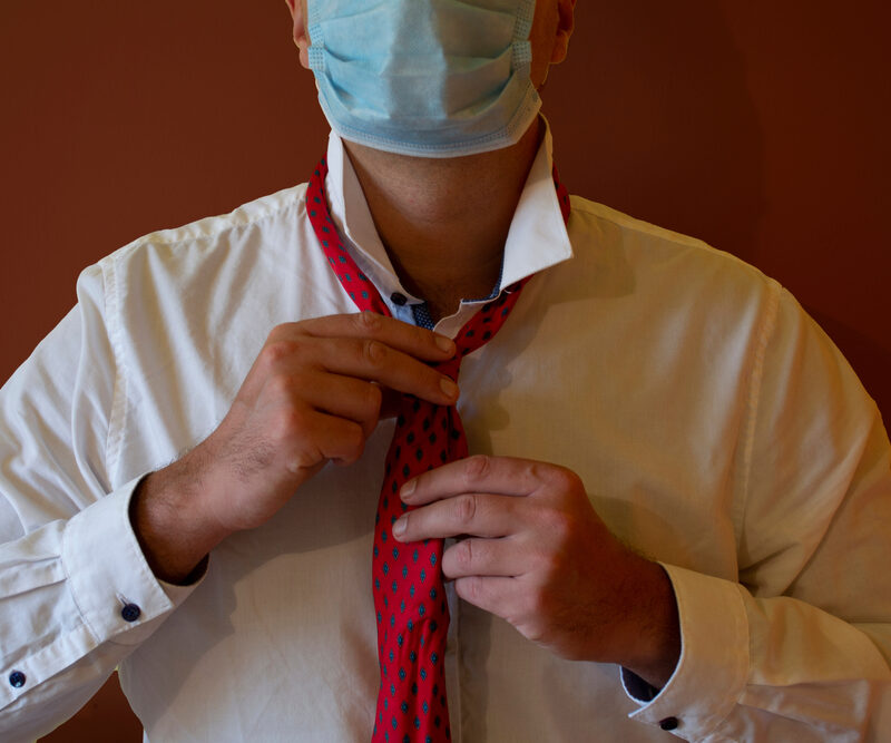 A person wearing a neck tie Description automatically generated